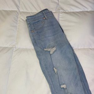 Light wash ripped skinny jeans with frayed bottoms